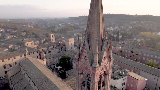 4K orbital close view of Castelvetro di Modena medieval bell tower village in Emilia Romagna,Italy