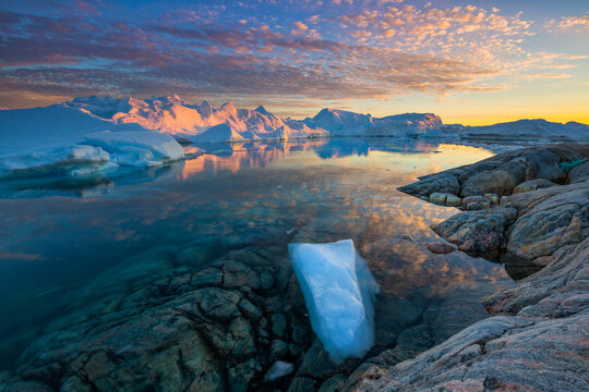 Clouds over Ilulissat Icefjord at scenic dusk, Greenland