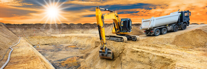 excavator ist digging and working at construction site