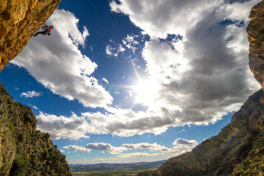 Man climbing up rock