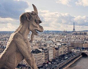 A gargoyle at Notre Dame cathedral stands guard over Paris.