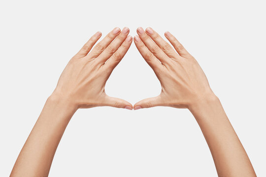 Female hands forming a triangle, symbol of women, feminist struggle. Conceptual feminism, female ...