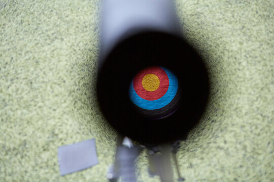 View through monocular on the target at archery practice