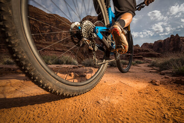 A low angle view of a mountain bike passing by on a dirt trail.
