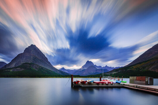 Kayaks on lakeside jetty, Browning, Montana, USA