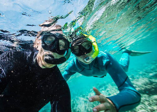 Two People Snorkeling Underwater