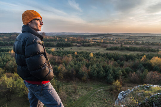 Man looking at view of forest, Polish Jura, Rzedkowice, Silesia, Poland