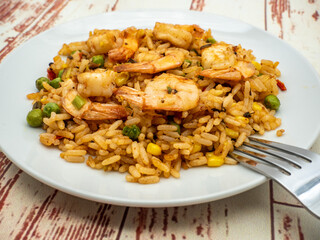 plate of shrimp fried rice with vegetables