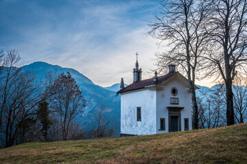 Fototapeta na wymiar Chiusaforte and the little church of Raunis seen from above. Friuli