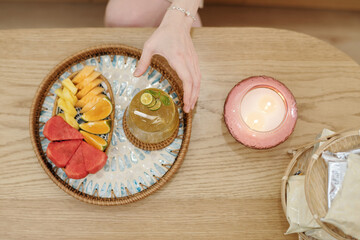 Refreshing drink and fresh fruits for spa salon client, view from above