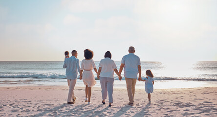 Grandparents, parents and children walking on beach for holiday, vacation and weekend by sea....