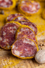 Sliced pork salami with spices and lots of turmeric