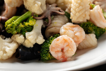 Closeup on portion of gourmet assorted seafood dish