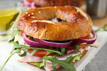 Concept of delicious food - tasty bagel sandwich
