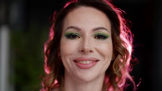 happy female face, closeup portrait of sensual beauty woman in studio, art pink contour light