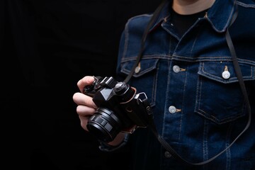 close up of a vintage camera held by a photographer