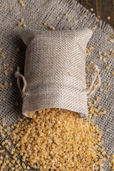Fresh wheat porridge in a linen bag