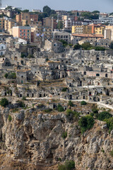 Panoramic view of Sassi di Matera a historic district in the city of Matera, well-known for their ancient cave dwellings from the Belvedere di Murgia Timone,  Basilicata, Italy