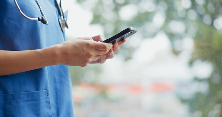 Hands of woman, phone and nurse in hospital for telehealth or online consultation. Healthcare,...