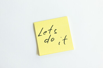 lets do it inscription on a piece of paper