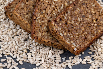 Black rye bread cut into chunks with sunflower seeds