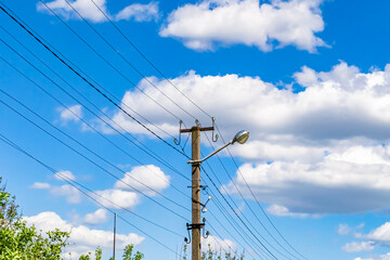 Power electric pole with line wire on colored background close up