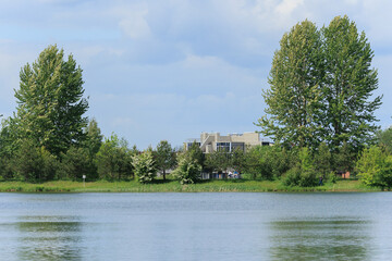 Buildings and houses standing on the shore of a lake, river or sea. 