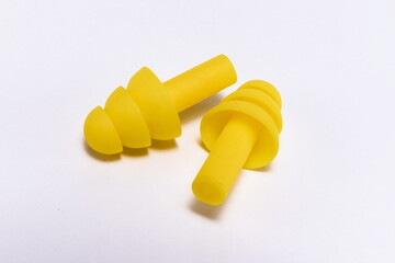 Silicone ear plugs for human ears on white background
