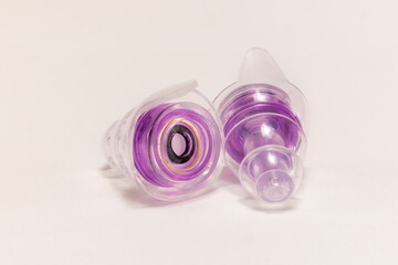 Silicone ear plugs for human ears on white background