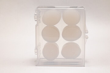 Silicone ear plugs for human ears on white background