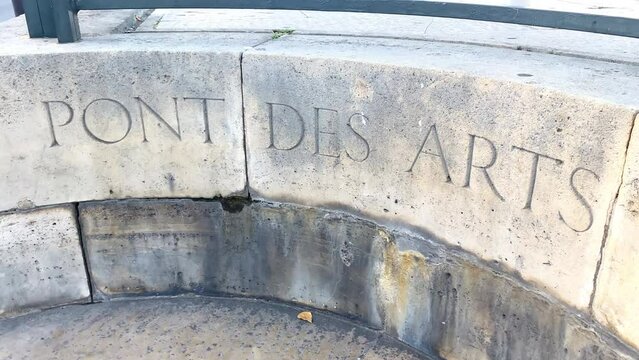 Name of the Pont des Arts engraved on the bridge in Paris, France