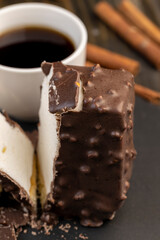 Fresh sweet cake with milk taste and aroma in chocolate glaze