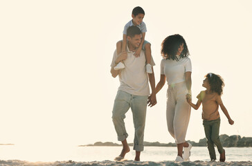 Happy, holding hands and walking family on the beach for travel, bonding and quality time in...