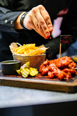 crispy fried breaded chicken breast strips french fries and sauce on plate