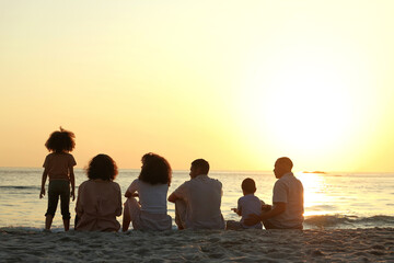 Relax, sunset and travel with big family on beach for vacation, support and happiness. Bonding,...