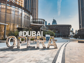 Dubai Opera house Sign in Downtown Dubai, surrounded by skyscrapers and Burj Khalifa, in UAE, United Arab Emirates