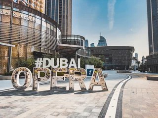 Foto op Canvas Dubai Opera house Sign in Downtown Dubai, surrounded by skyscrapers and Burj Khalifa, in UAE, United Arab Emirates © pierrick