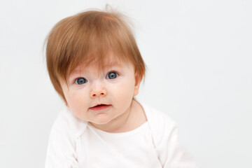 Portrait of cute happy six month baby girl. Childhood and baby care concept