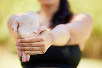 Closeup, hands and woman stretching in nature for fitness, yoga and cardio workout on blurred...