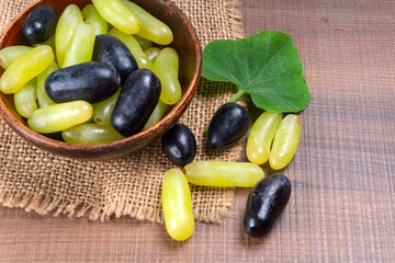 Natural organic different types of fresh ripe juicy grapes and space for text on table. top view, Agriculture concepts.