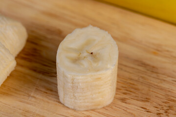 a ripe sweet banana cut into pieces lies on the table