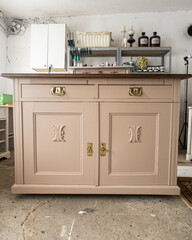 Oak chest of drawers after renovation painted beige. Photos from the workshop.