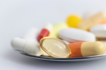 Macro photo of Medicinal Medicines stacked in a metal spoon. Stock photo.