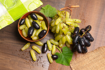 Natural organic different types of fresh ripe juicy grapes and space for text on table. top view, Agriculture concepts.