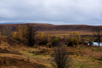 Amazingly beautiful autumn landscapes of a mountainous area located in northern China. Rainy landscape with clouds on top of mountains. Beautiful non-tourist routes. Exploring new places.