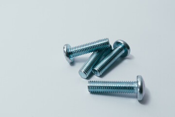 Steel screw. Screws on white background. Some metal machine screw bolts on white background.