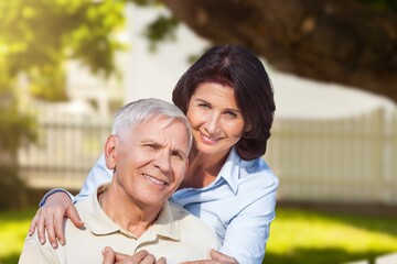 Happy senior old couple together in garden