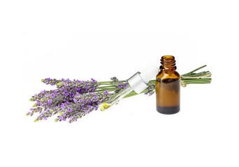 Amber essential lavender oil bottle. Pipette with drop and bottle on an isolated background.