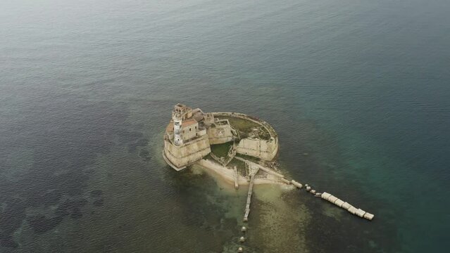 Aerial view of Isola di Torre Avalos, a fort in the Mediterranean Sea near Augusta, Sicily, Italy.