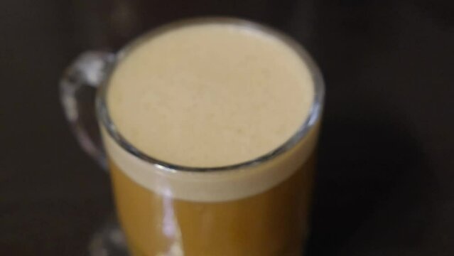 Rack Focus On A Cup Of Keto-friendly Bulletproof Coffee. closeup